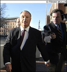 MOVING TARGET: Urciuoli (center) takes part in the Rhode Island ritual of another scandal-related arraignment. MOVING TARGET: Urciuoli (center) takes part in the Rhode Island ritual of another scandal-related arraignment.